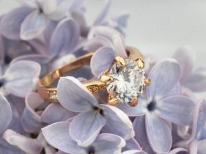 Jewelry Ring with diamond on violet flower, soft focus